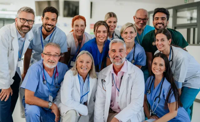 Portrait of happy doctors, nurses and other medical staff in a hospital.